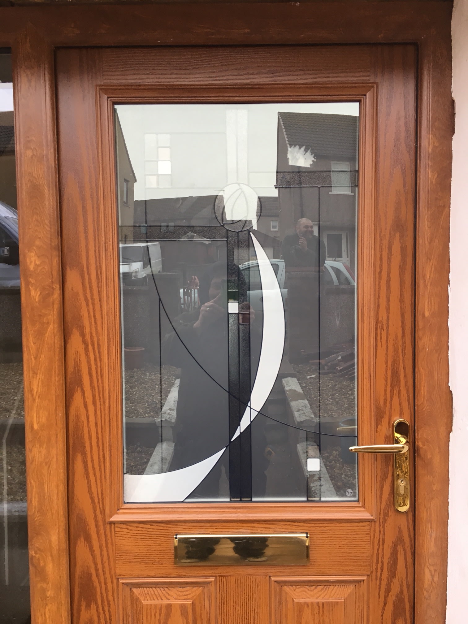 Wood-effect finish with decorative glazing.